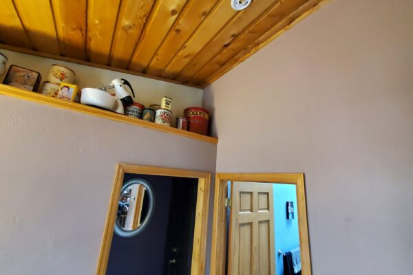 Soft neutral interior with wood ceiling detail